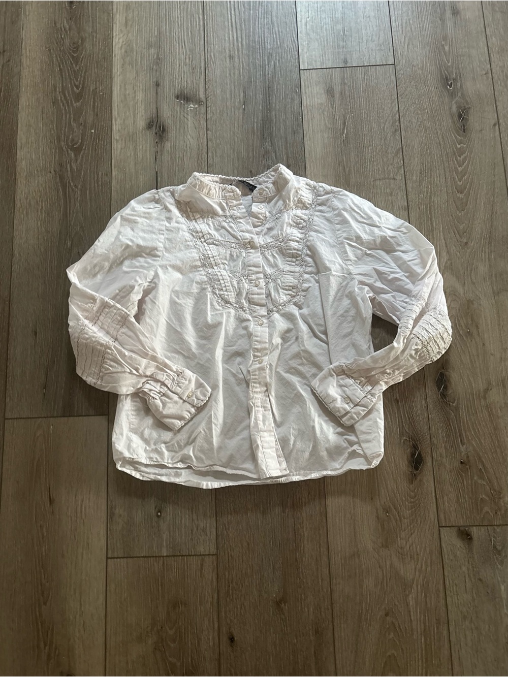 Women’s white Zara blouse with lace detailing.